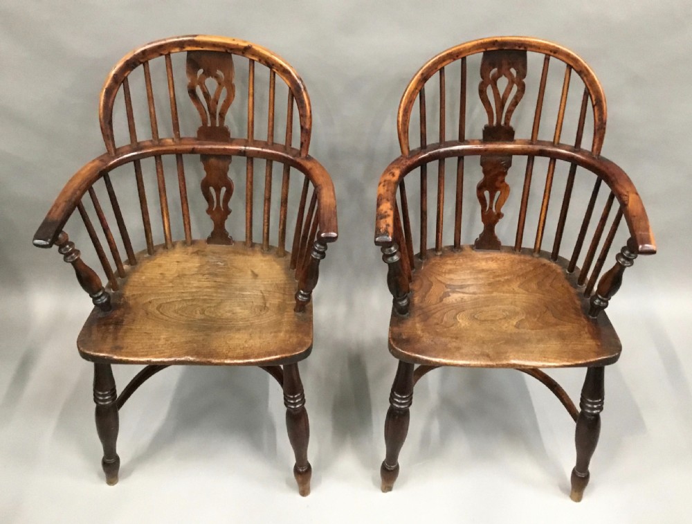 A pair of 19th-century hoop-back Windsor armchairs with pierced central splats, turned legs, curved stretchers, and richly patinated timber. View III