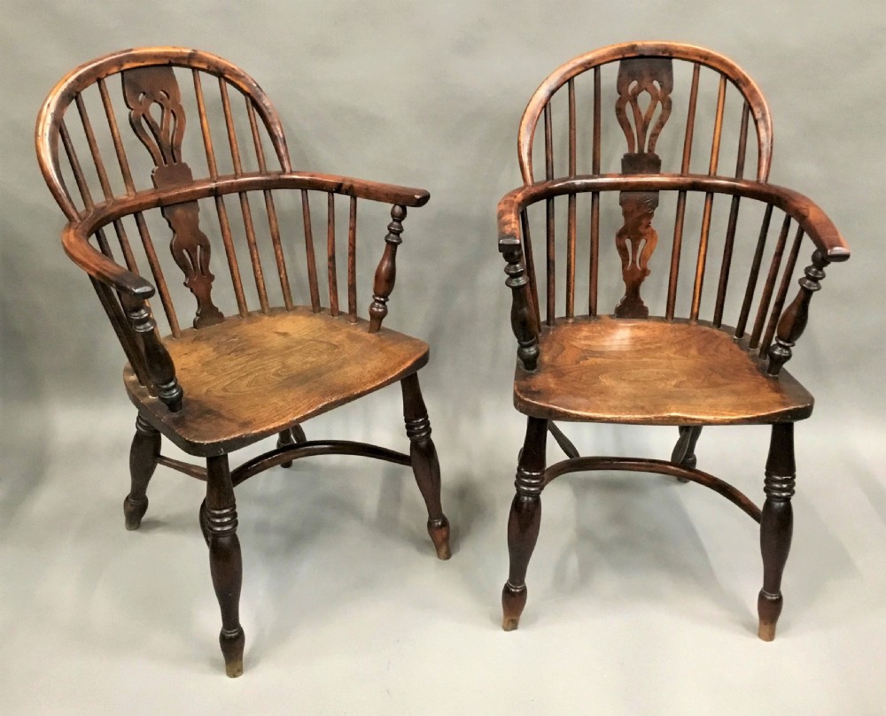 A pair of 19th-century hoop-back Windsor armchairs with pierced central splats, turned legs, curved stretchers, and richly patinated timber. View VIII