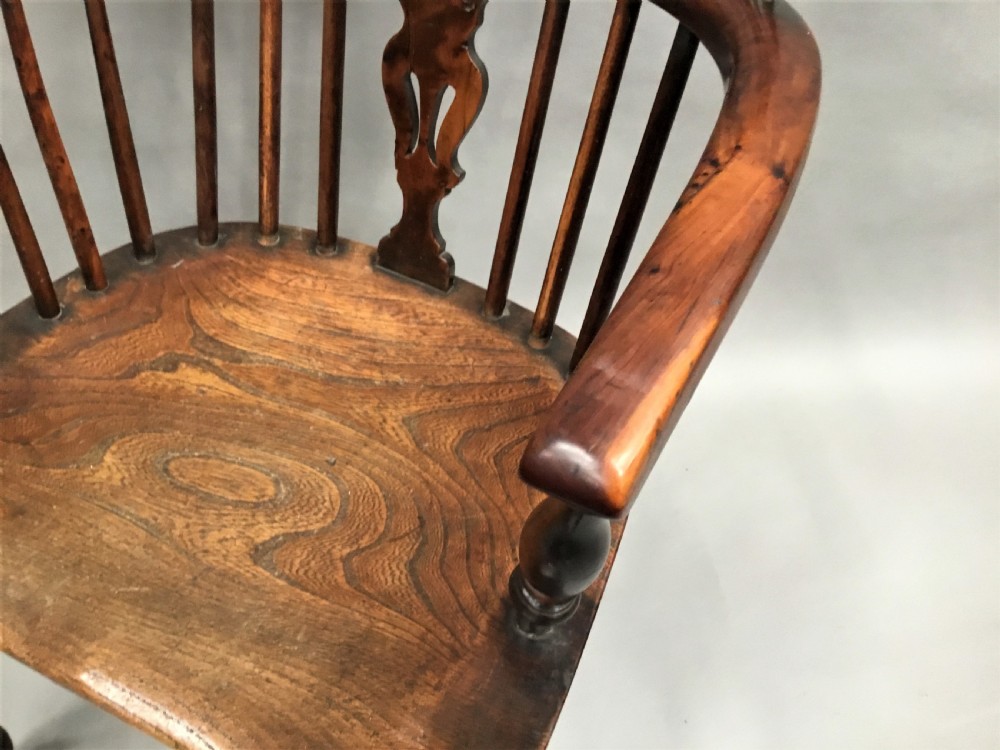 A pair of 19th-century hoop-back Windsor armchairs with pierced central splats, turned legs, curved stretchers, and richly patinated timber. View XIV