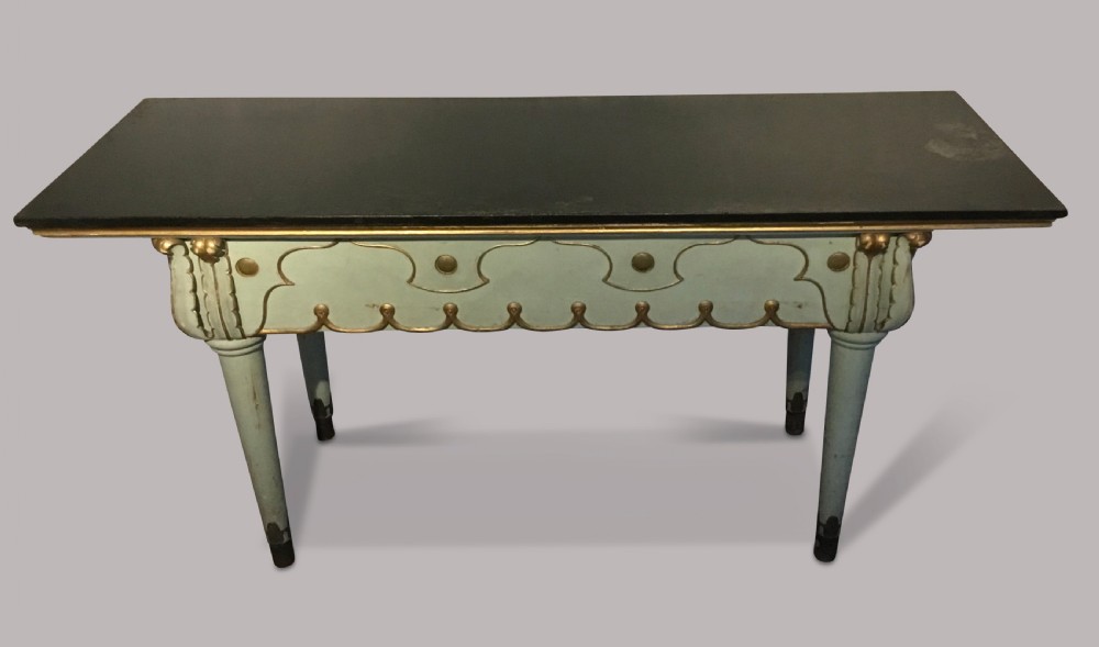 A 19th-century Italian painted side table with a dark top, sage green frame, turned tapering legs, and gilded scalloped apron details. View III
