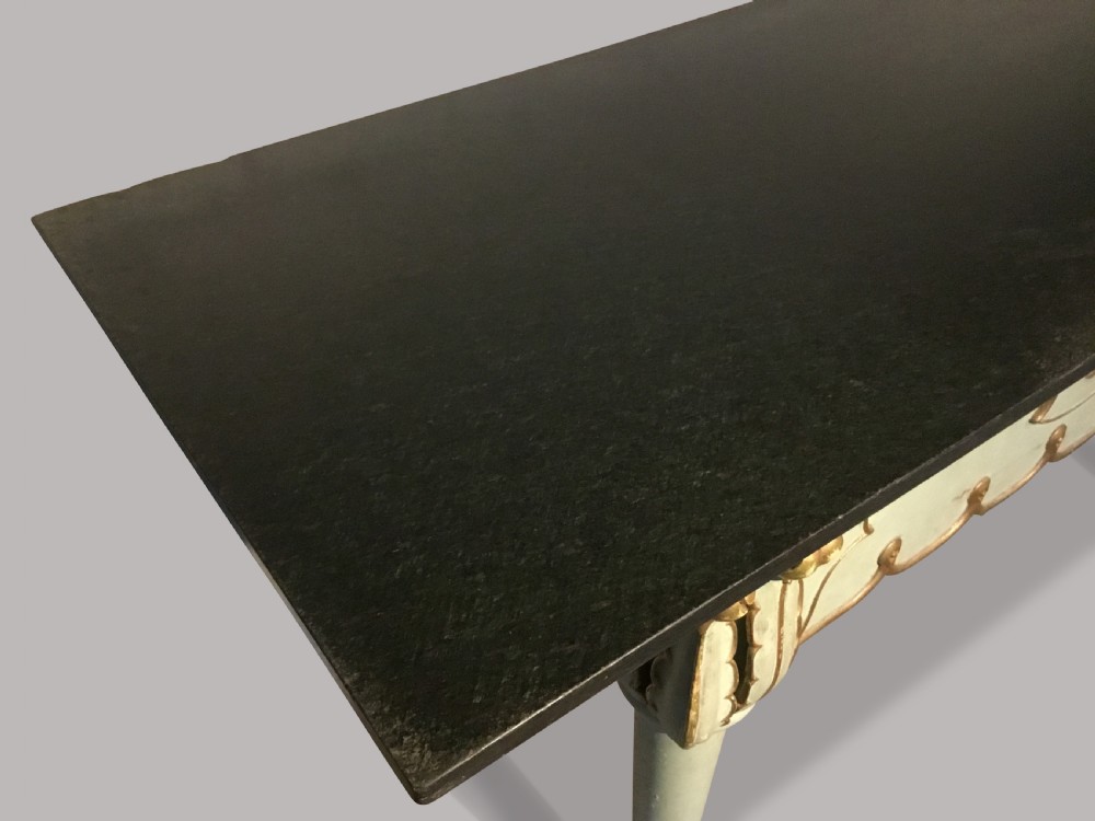 A 19th-century Italian painted side table with a dark top, sage green frame, turned tapering legs, and gilded scalloped apron details. View IV