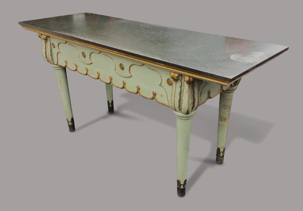 A 19th-century Italian painted side table with a dark top, sage green frame, turned tapering legs, and gilded scalloped apron details. View IX