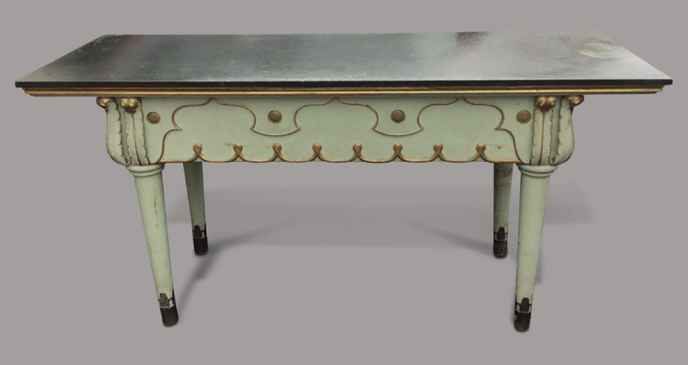 A 19th-century Italian painted side table with a dark top, sage green frame, turned tapering legs, and gilded scalloped apron details. View XIV