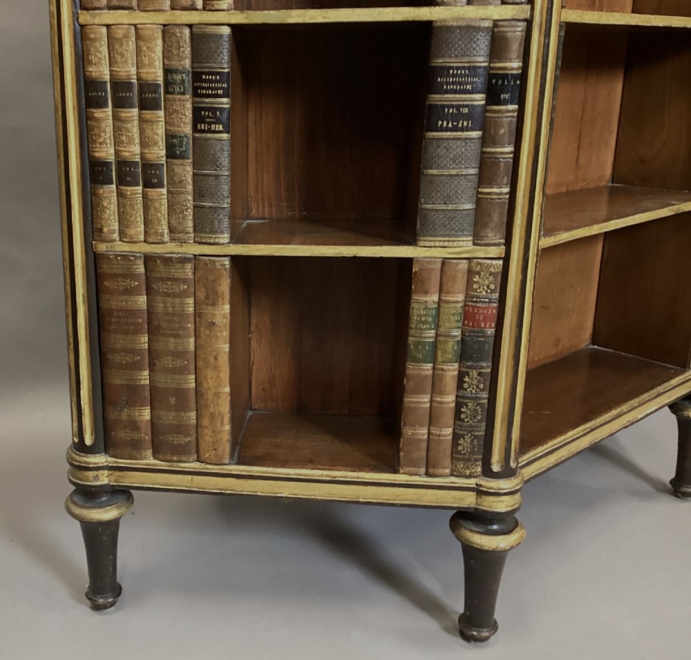 A Regency rosewood breakfront open cabinet featuring a marble top with a brass gallery, central open shelves flanked by faux leather book spines, and fluted gilt columns on tapered legs. View V