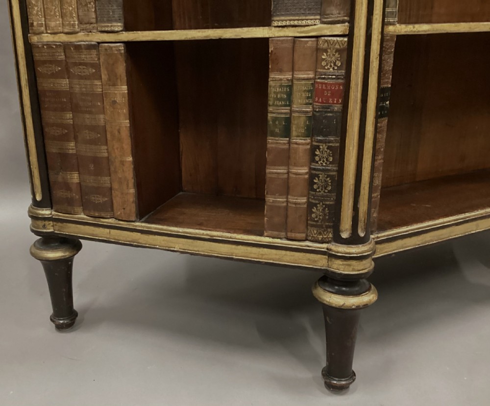 A Regency rosewood breakfront open cabinet featuring a marble top with a brass gallery, central open shelves flanked by faux leather book spines, and fluted gilt columns on tapered legs. View XI