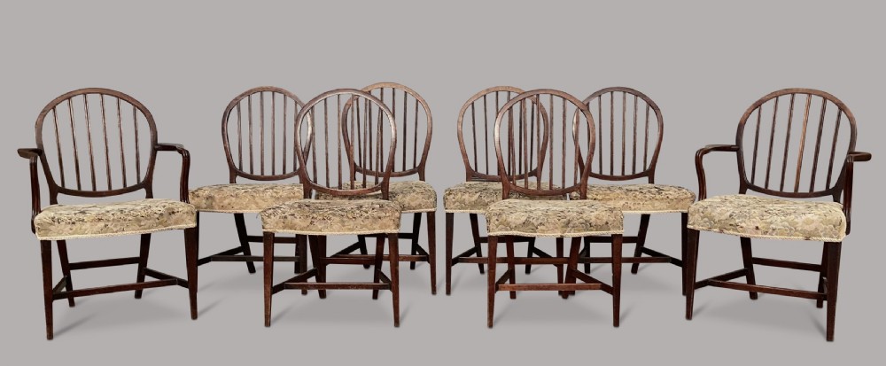 George III set of 8 mahogany dining chairs; with unusual backs in the Hepplewhite manner View II