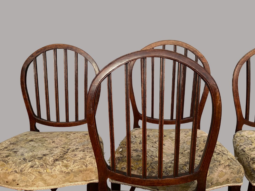 George III set of 8 mahogany dining chairs; with unusual backs in the Hepplewhite manner View IX