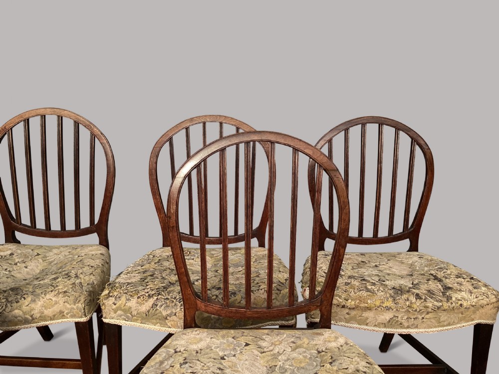 George III set of 8 mahogany dining chairs; with unusual backs in the Hepplewhite manner View X