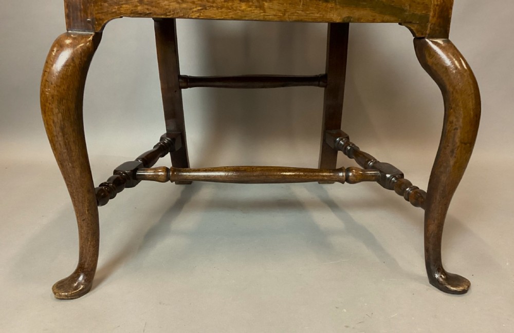 A pair of 18th-century Chinese Huanghuali side chairs featuring curved backsplats and yellow upholstered seats. View XXIII