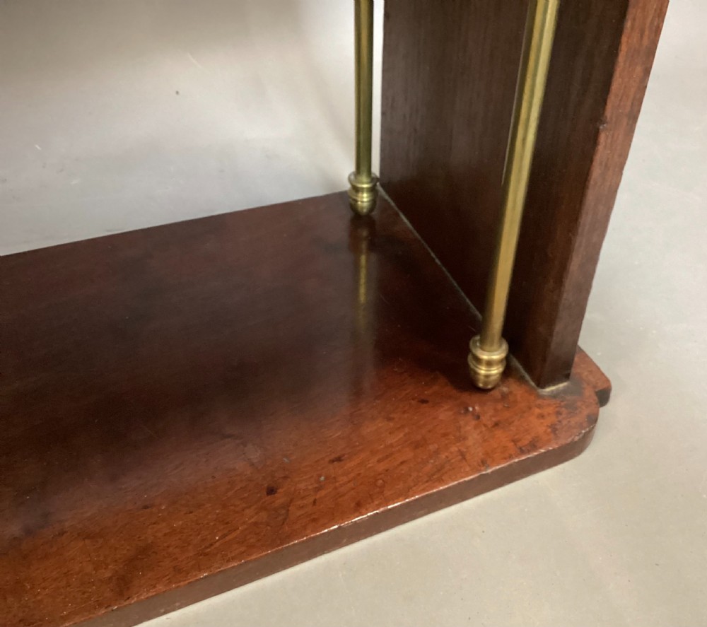 A four-tier Regency mahogany wall shelf unit featuring vertical brass support rods and top brass mounting brackets. View XIII