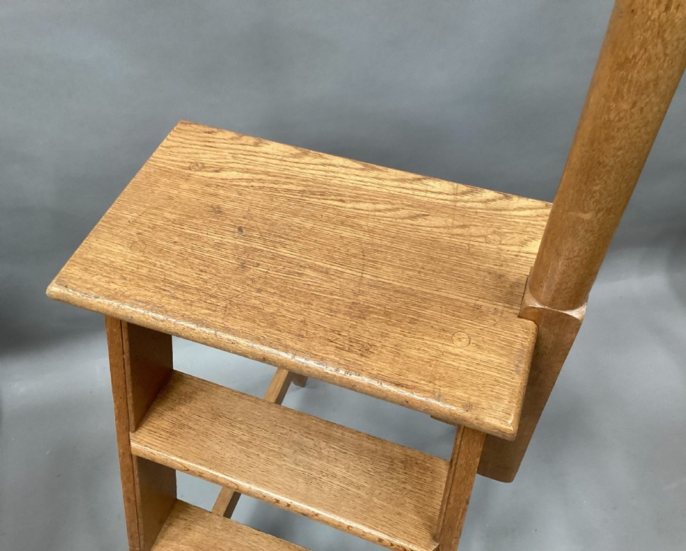 Nineteenth-century golden oak library steps featuring three treads, a top platform, an A-frame structure, and an integrated vertical hand pole. View XIV
