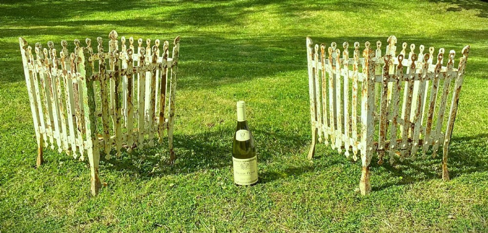 A pair of square 19th-century wrought iron strapwork planters with distressed cream paint, finial borders, and solid metal liners. View II