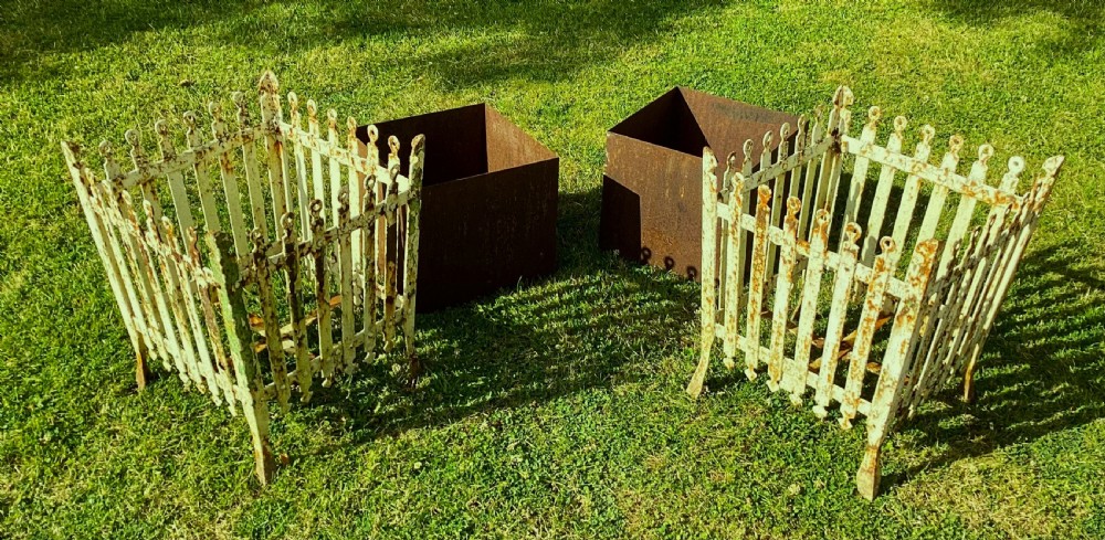A pair of square 19th-century wrought iron strapwork planters with distressed cream paint, finial borders, and solid metal liners. View III