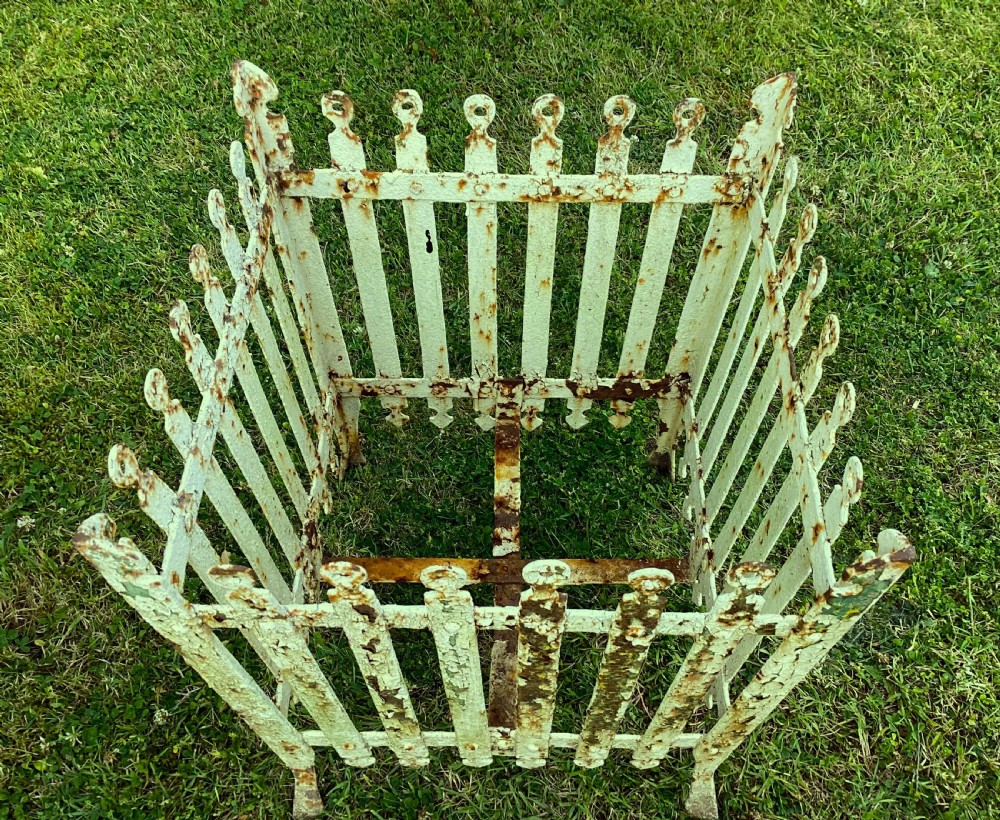 A pair of square 19th-century wrought iron strapwork planters with distressed cream paint, finial borders, and solid metal liners. View XI