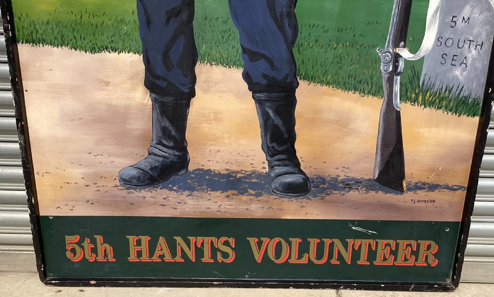 A large rectangular hand-painted panel depicting a soldier in a red tunic and blue trousers drinking from a tankard alongside military gear and text reading 5th Hants Volunteer. View VI