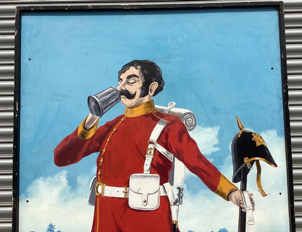 A large rectangular hand-painted panel depicting a soldier in a red tunic and blue trousers drinking from a tankard alongside military gear and text reading 5th Hants Volunteer. View VII