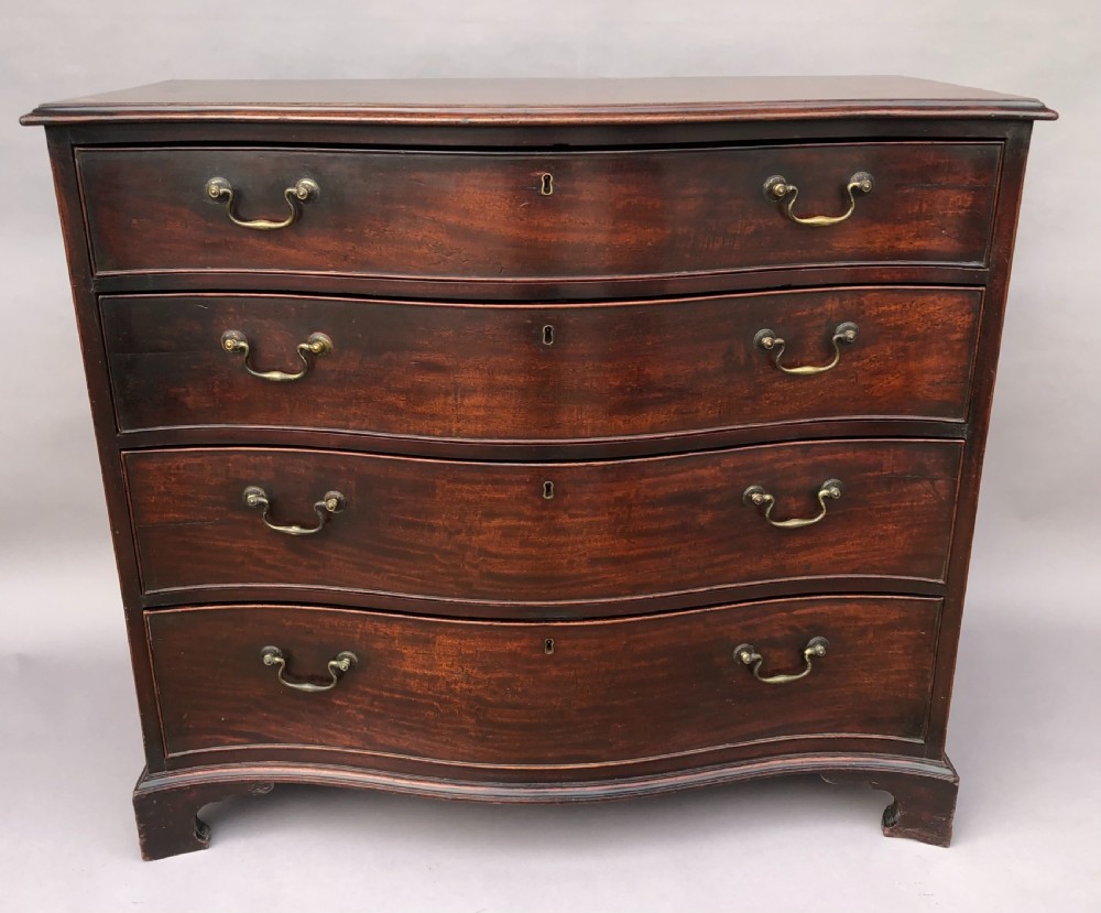 George III Chippendale mahogany serpentine chest of drawers; attributed to Thomas Chippendale View II