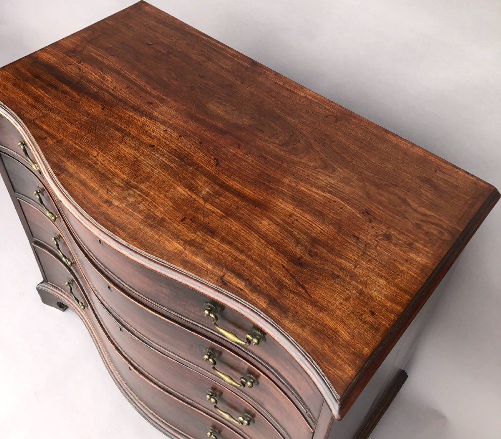 George III Chippendale mahogany serpentine chest of drawers; attributed to Thomas Chippendale View IV