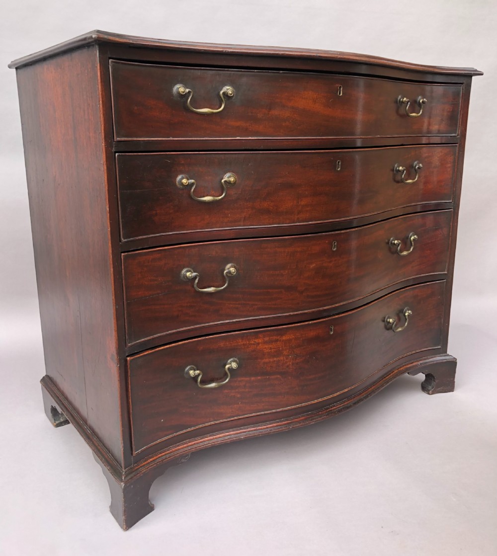 George III Chippendale mahogany serpentine chest of drawers; attributed to Thomas Chippendale View V