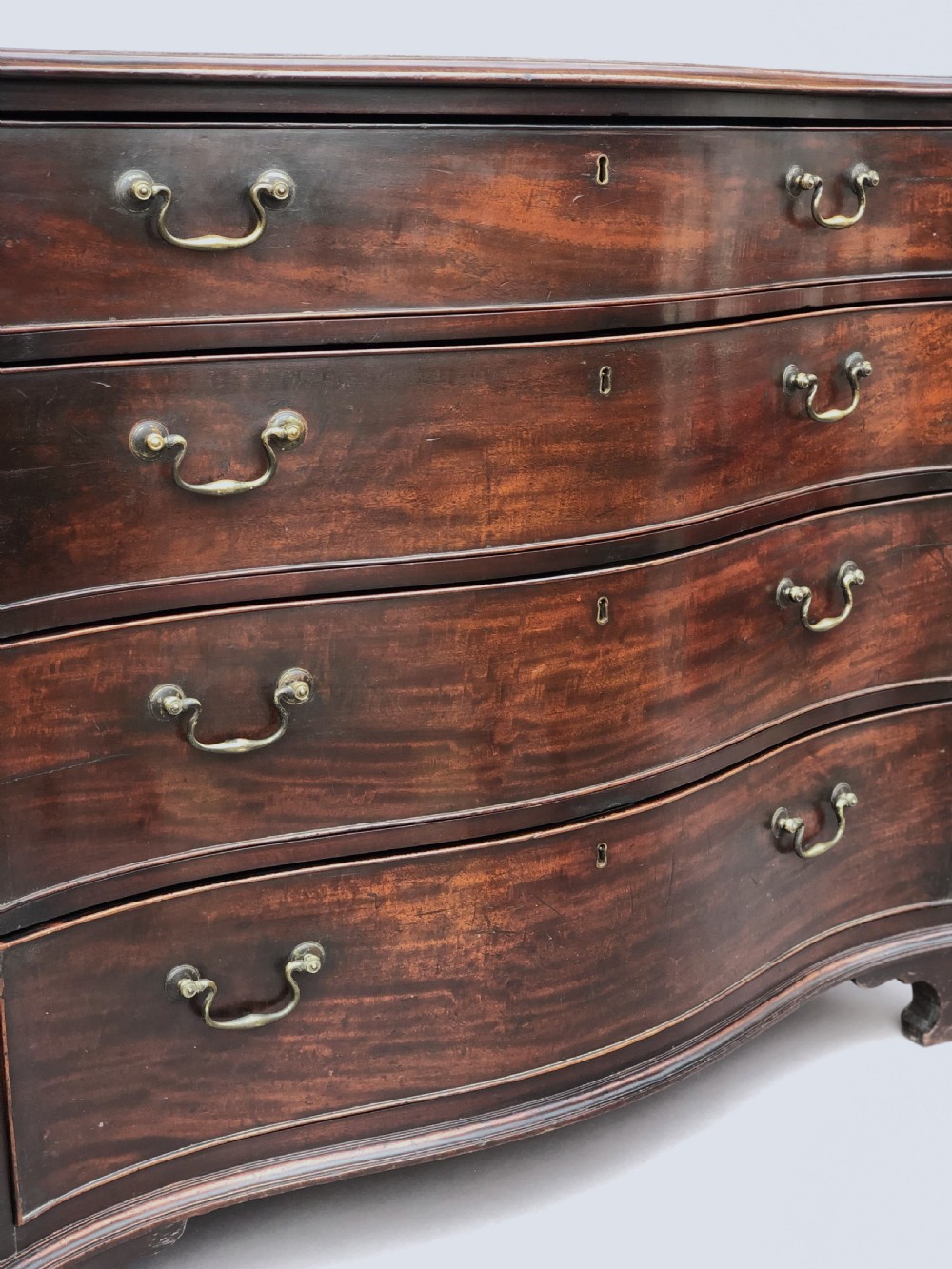 George III Chippendale mahogany serpentine chest of drawers; attributed to Thomas Chippendale View VI