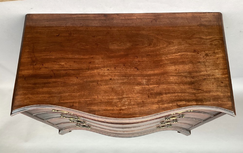 George III Chippendale mahogany serpentine chest of drawers; attributed to Thomas Chippendale View VII