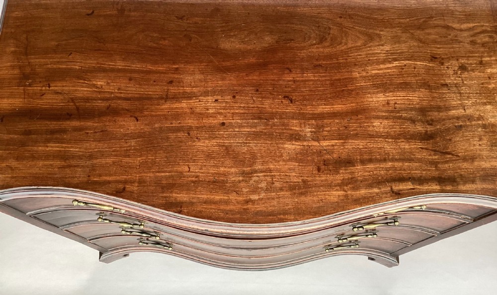 George III Chippendale mahogany serpentine chest of drawers; attributed to Thomas Chippendale View XV