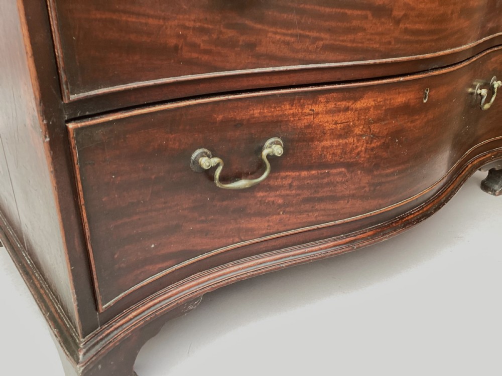 George III Chippendale mahogany serpentine chest of drawers; attributed to Thomas Chippendale View XVI