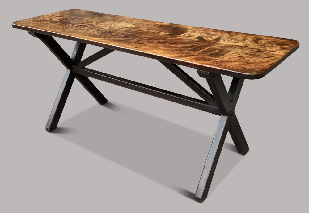 A Georgian elm tavern table featuring a long rectangular polished timber top over a dark X-frame base. View X