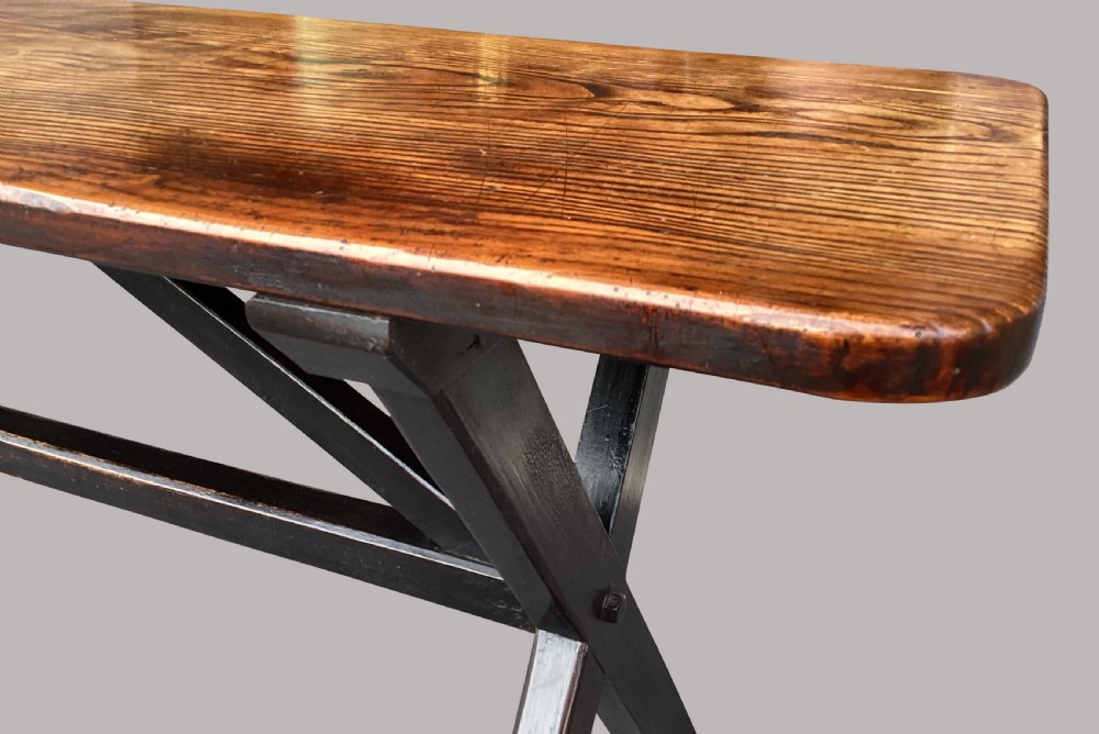 A Georgian elm tavern table featuring a long rectangular polished timber top over a dark X-frame base. View XIX