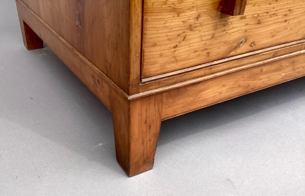 An Arts and Crafts solid yew wood chest featuring six graduated drawers with simple square wooden pulls. View XIV