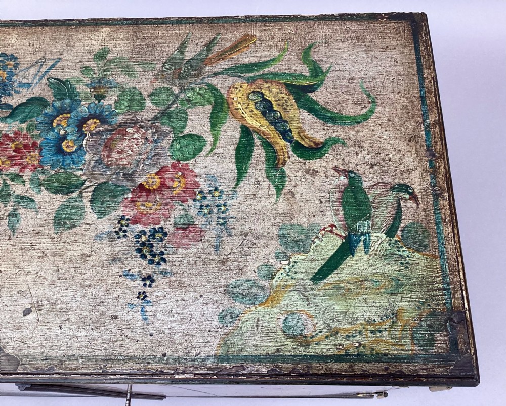 An eighteenth-century hand-painted wooden cabinet on a tall stand, featuring floral artwork across the twin doors, side panels, and apron, mounted with brass hinges. View XIII