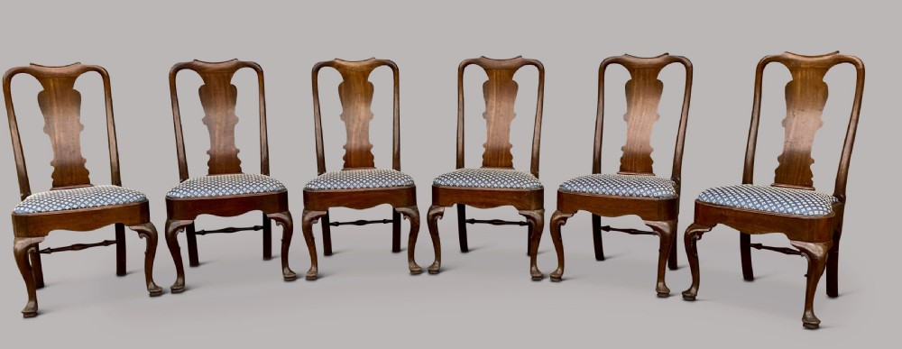A set of six George II red walnut side dining chairs with shaped vasiform splats, cabriole front legs, and blue patterned drop-in seats. View III