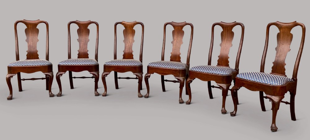 A set of six George II red walnut side dining chairs with shaped vasiform splats, cabriole front legs, and blue patterned drop-in seats. View XI