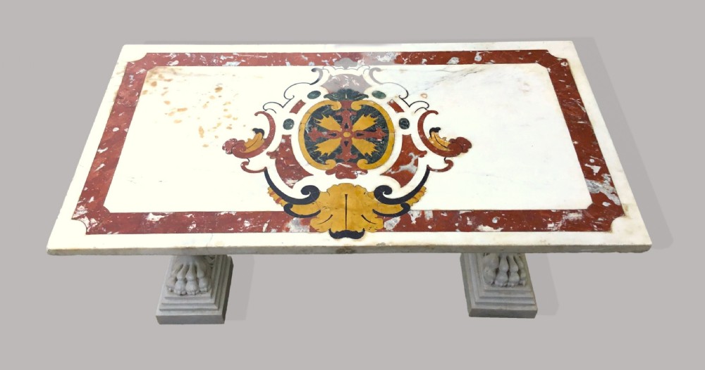 An 18th-century Italian rectangular marble coffee table featuring pietre dure specimen stone inlay and carved lion-paw pedestal supports. View II