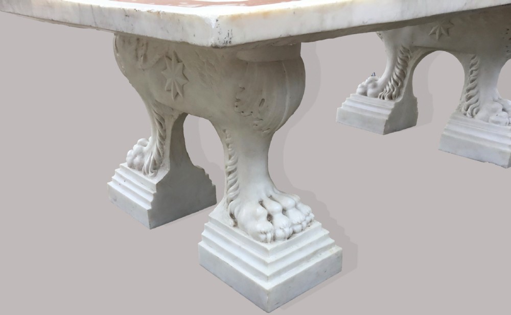 An 18th-century Italian rectangular marble coffee table featuring pietre dure specimen stone inlay and carved lion-paw pedestal supports. View VI
