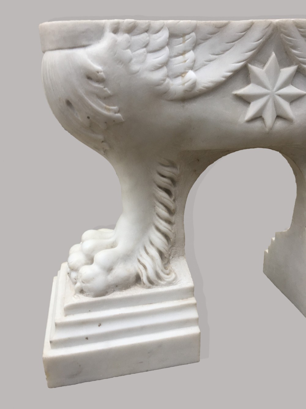 An 18th-century Italian rectangular marble coffee table featuring pietre dure specimen stone inlay and carved lion-paw pedestal supports. View X