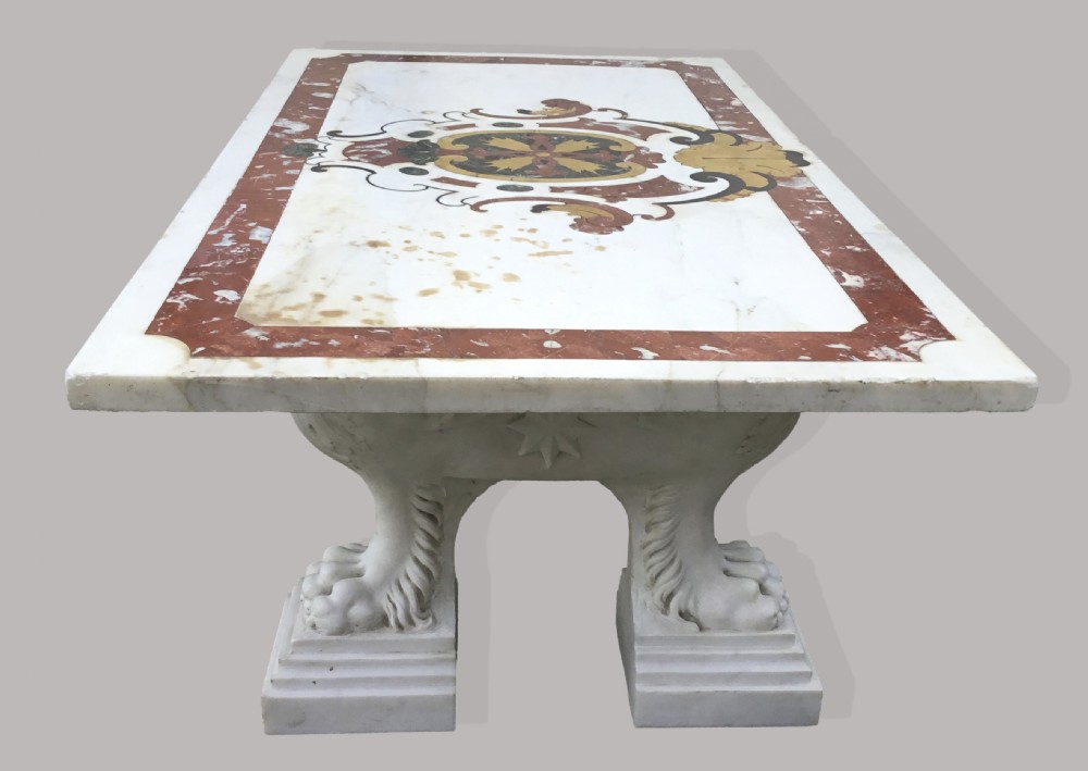 An 18th-century Italian rectangular marble coffee table featuring pietre dure specimen stone inlay and carved lion-paw pedestal supports. View XII