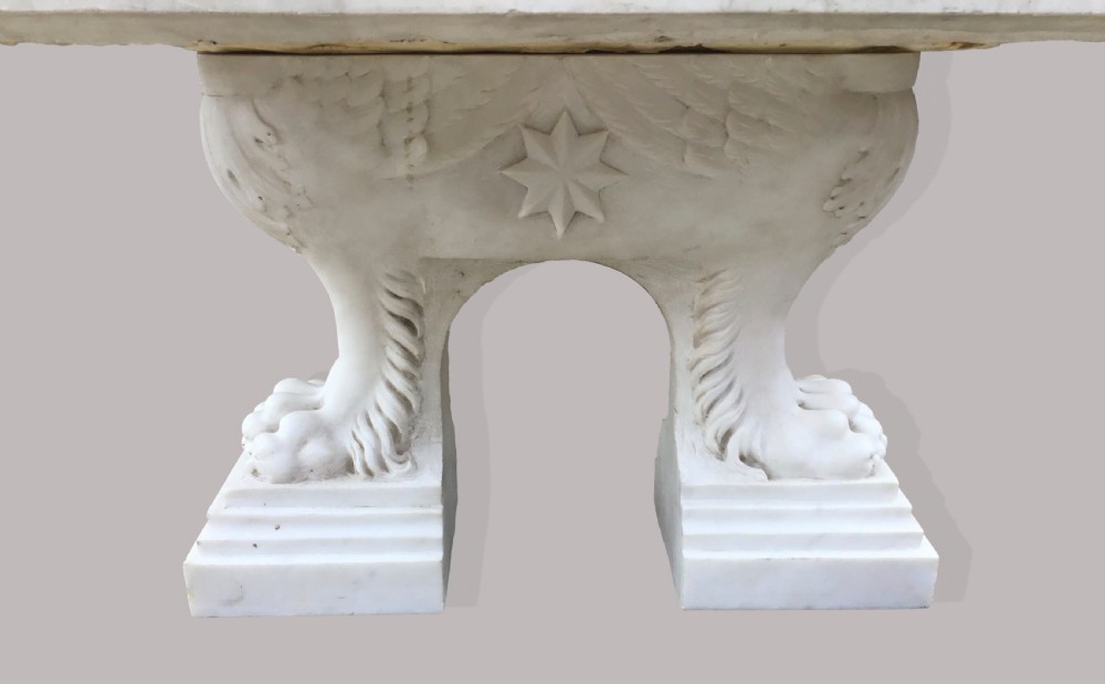 An 18th-century Italian rectangular marble coffee table featuring pietre dure specimen stone inlay and carved lion-paw pedestal supports. View XVII