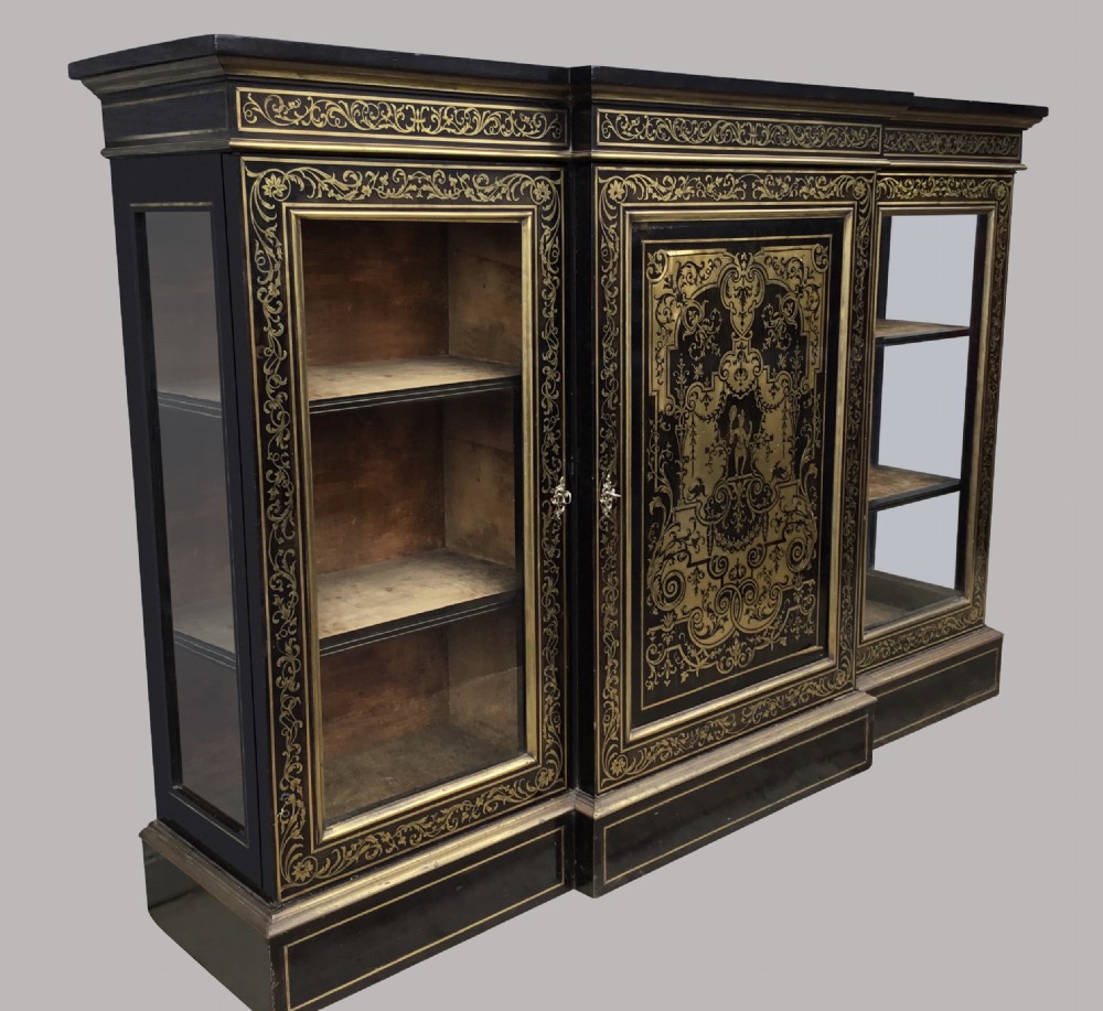 A 19th-century ebony breakfront side cabinet featuring central Boulle brass marquetry door panels flanked by two glazed display cabinet doors. View II
