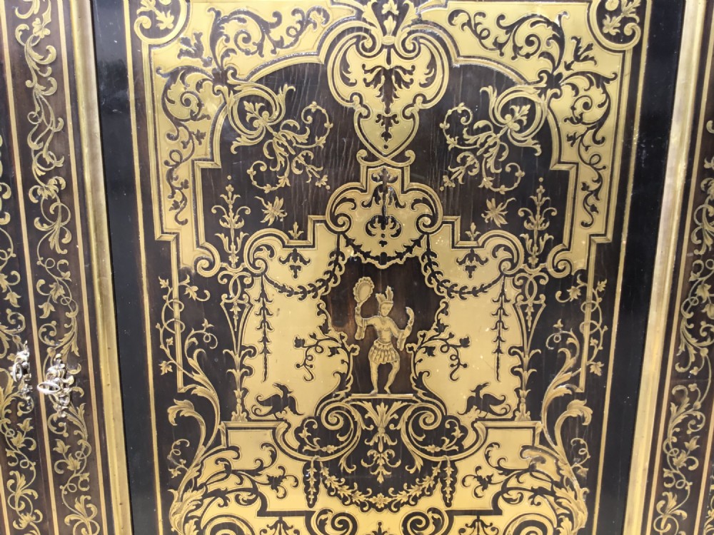 A 19th-century ebony breakfront side cabinet featuring central Boulle brass marquetry door panels flanked by two glazed display cabinet doors. View III