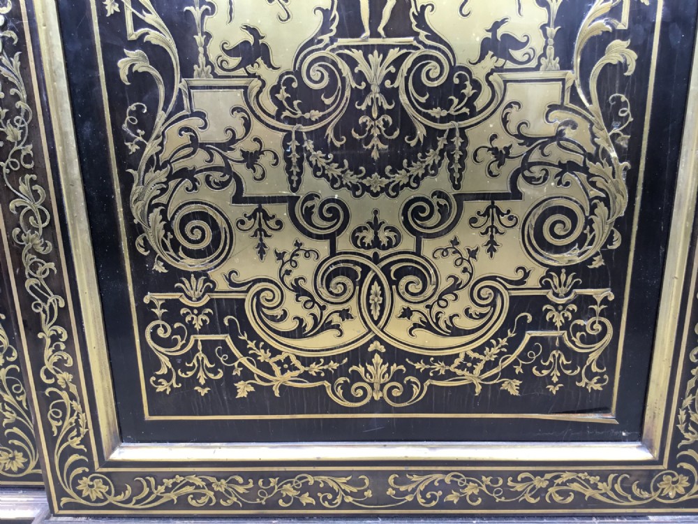 A 19th-century ebony breakfront side cabinet featuring central Boulle brass marquetry door panels flanked by two glazed display cabinet doors. View VIII