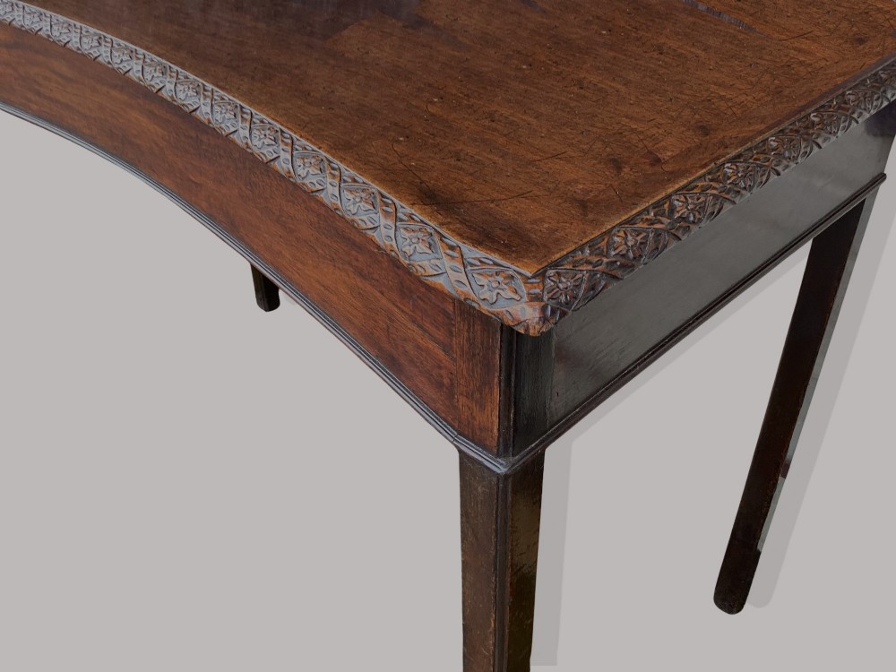 A George III mahogany side table featuring a rectangular carved-edge top, plain frieze, and straight legs. View V