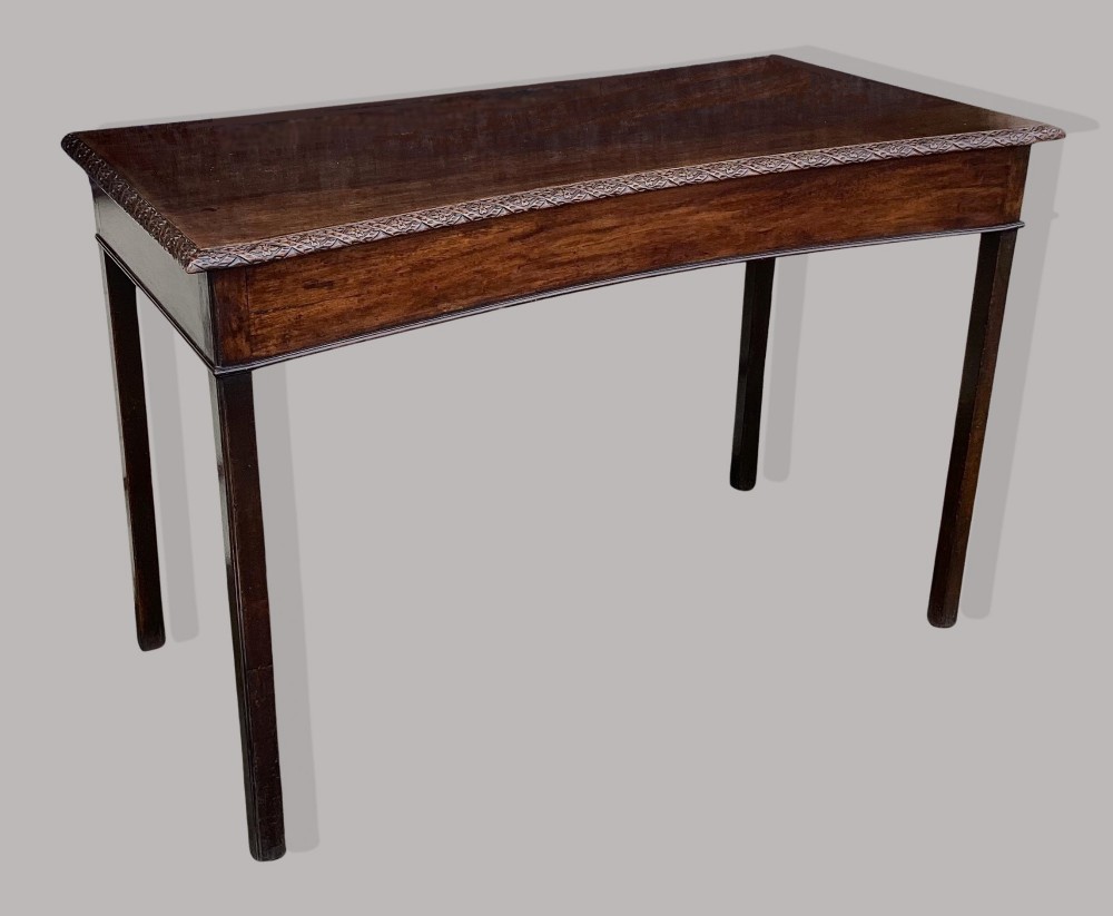 A George III mahogany side table featuring a rectangular carved-edge top, plain frieze, and straight legs. View VII