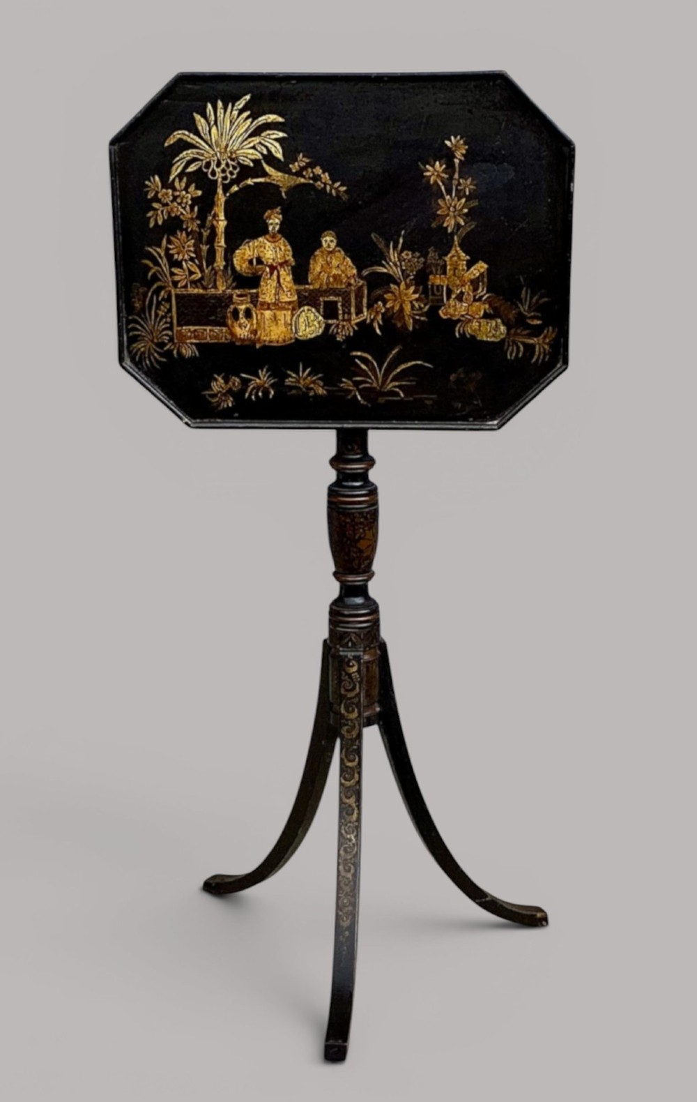 A Regency black lacquered octagonal top wine table with gilded Chinoiserie figure decoration on a turned tripod base. View II