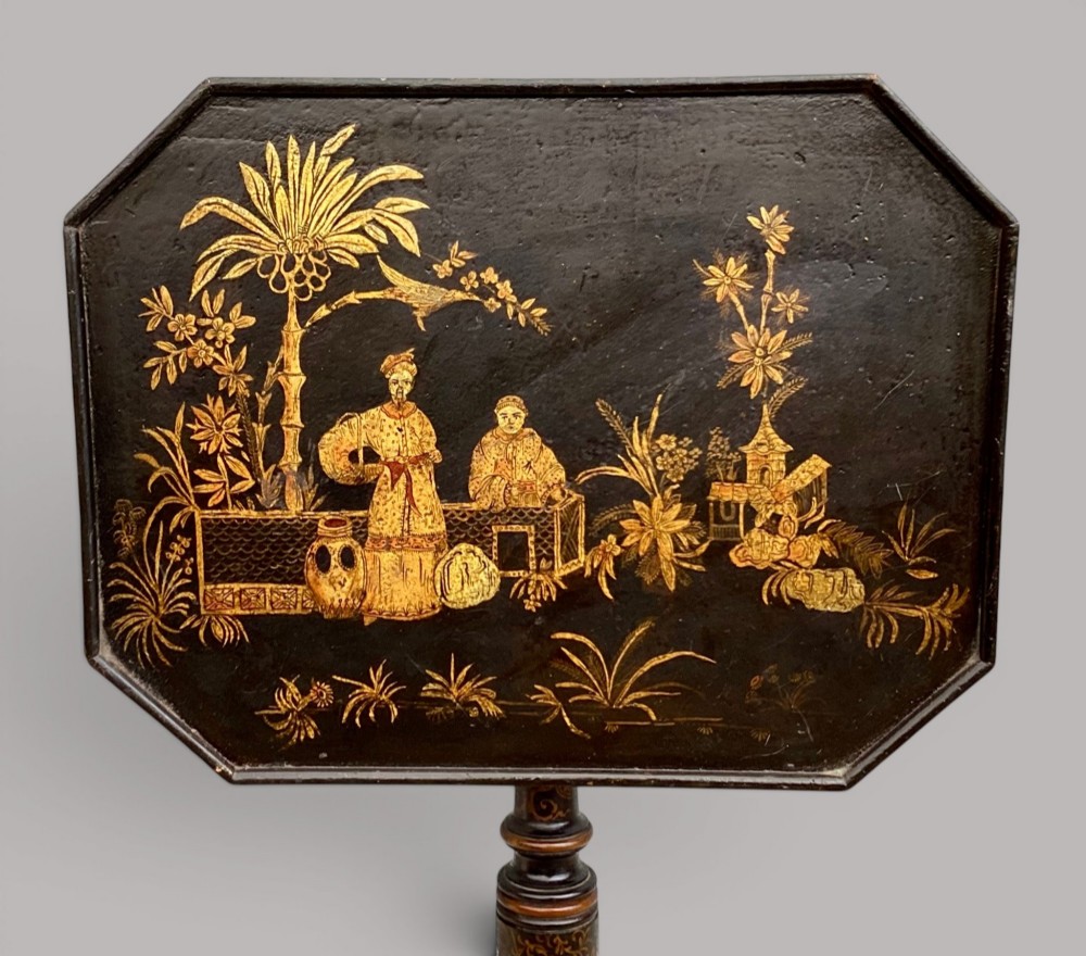 A Regency black lacquered octagonal top wine table with gilded Chinoiserie figure decoration on a turned tripod base. View III