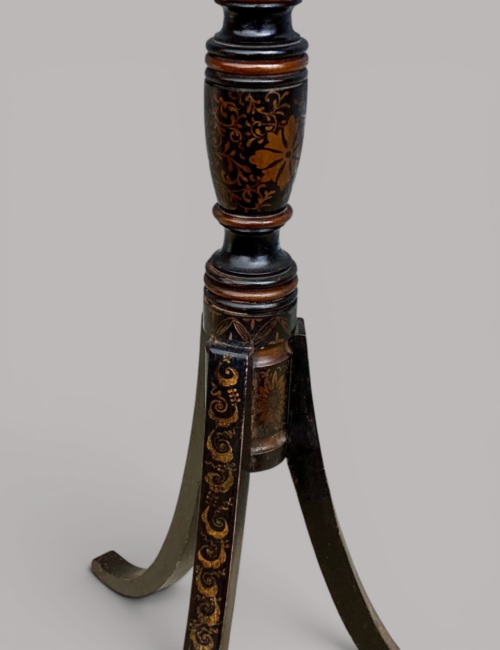 A Regency black lacquered octagonal top wine table with gilded Chinoiserie figure decoration on a turned tripod base. View IV