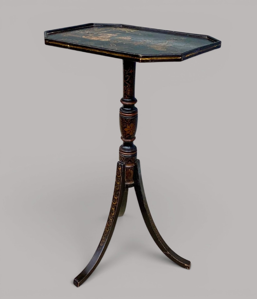 A Regency black lacquered octagonal top wine table with gilded Chinoiserie figure decoration on a turned tripod base. View VI