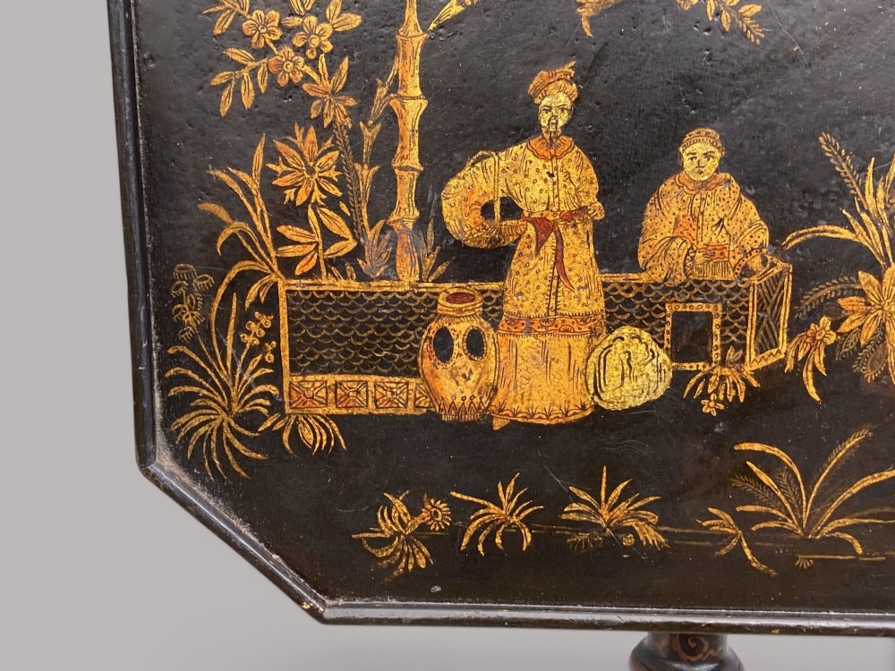 A Regency black lacquered octagonal top wine table with gilded Chinoiserie figure decoration on a turned tripod base. View XI