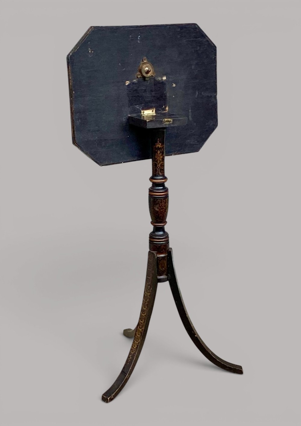 A Regency black lacquered octagonal top wine table with gilded Chinoiserie figure decoration on a turned tripod base. View XII