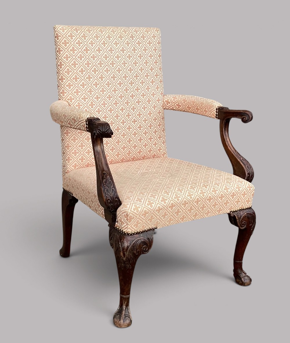 An 18th-century style George II mahogany open armchair upholstered in a cream and red geometric patterned fabric with carved cabriole legs. View II